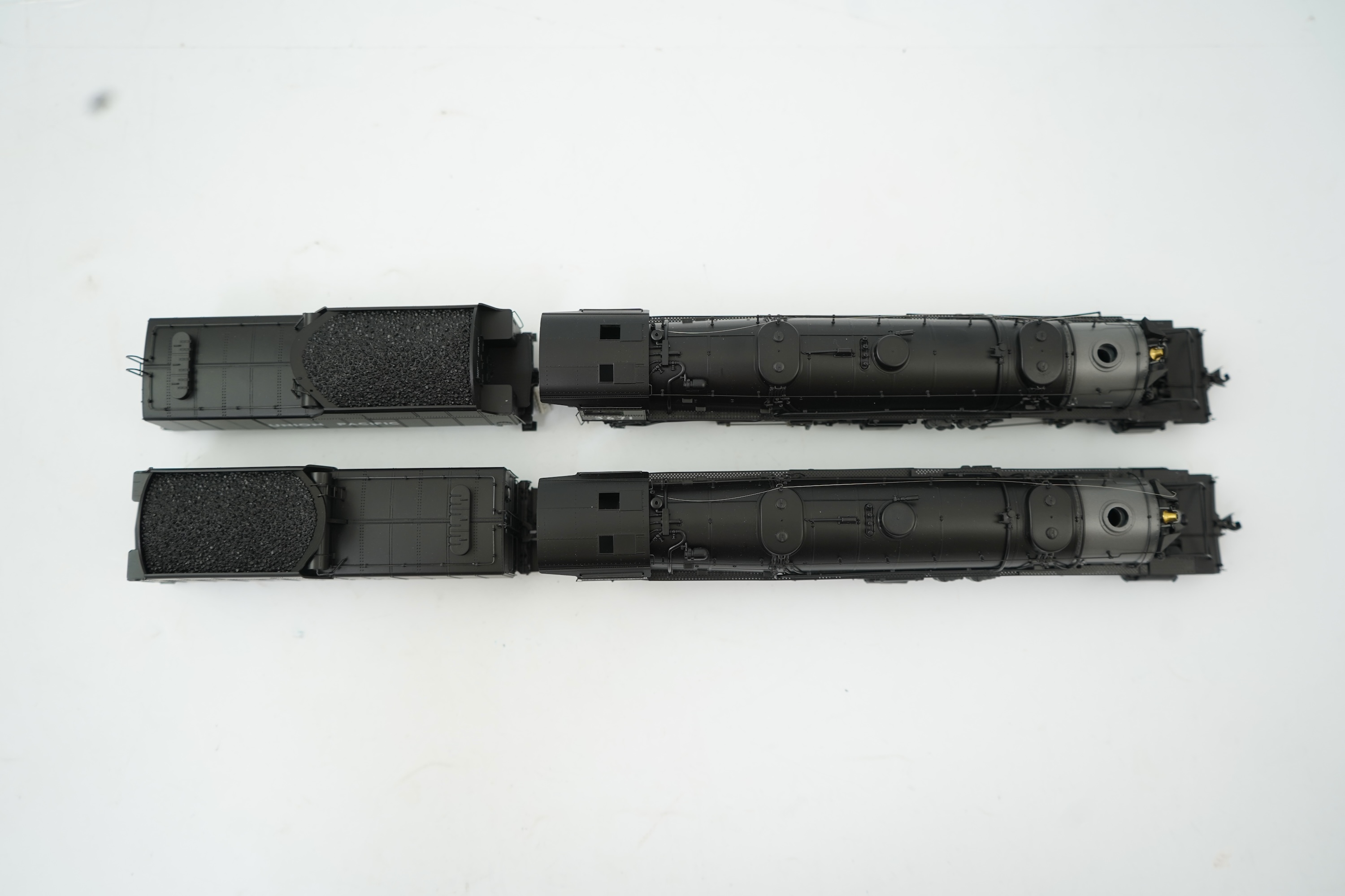Two boxed HO gauge Proto 2000 Heritage Union Pacific locomotives; (23342) model of 3671, 2-8-8-2 tender locomotive, and (23343) model of 3673, 2-8-8-2 tender locomotive, both powered for two rail operation.